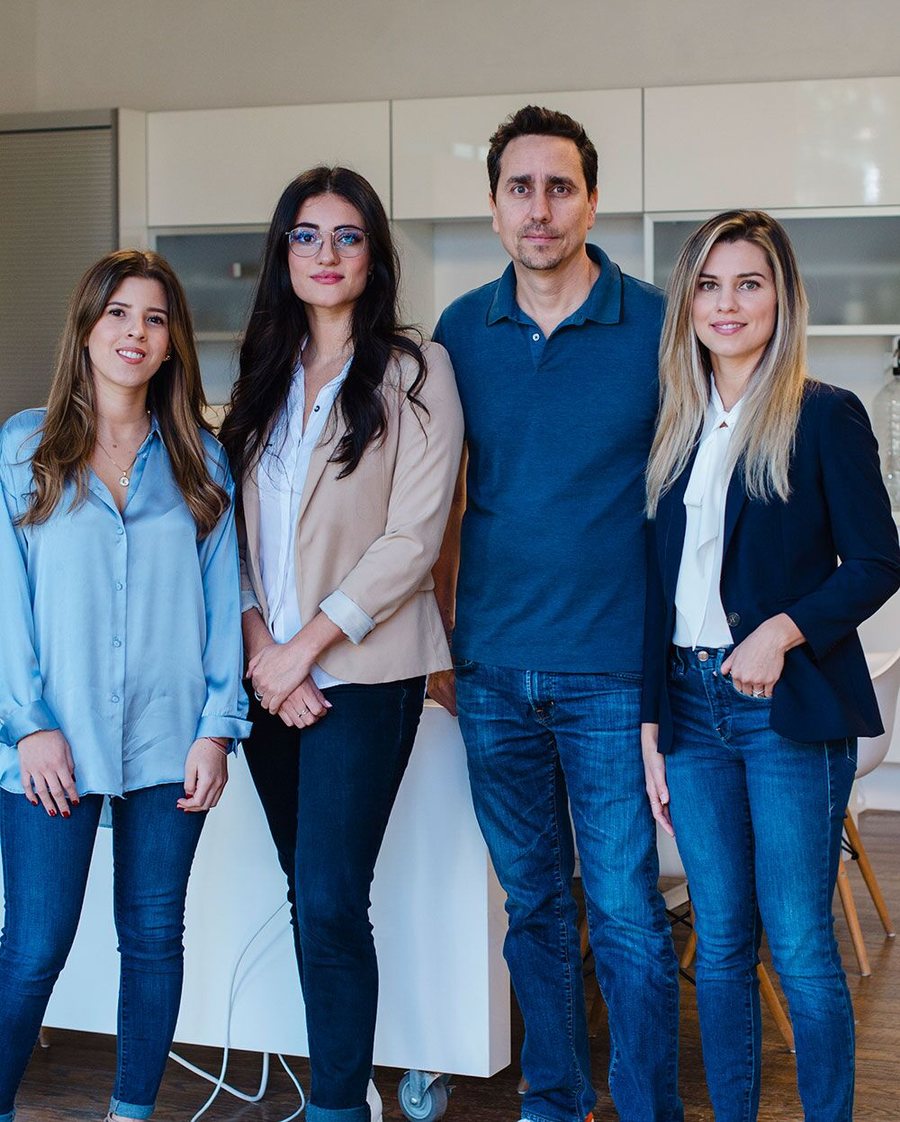 Four members of the LawRank team standing together in the office